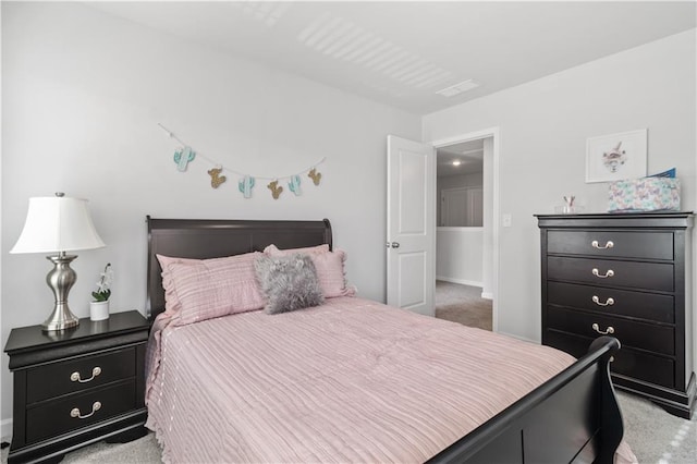 bedroom with light colored carpet