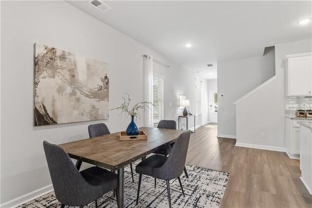 dining area featuring light wood-type flooring