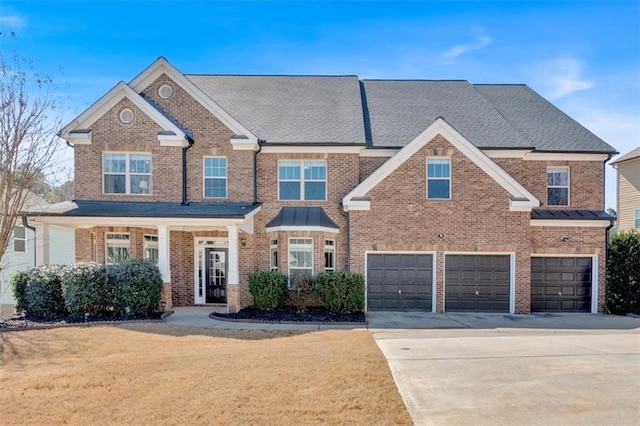 view of front of property featuring a garage, driveway, brick siding, and a front yard