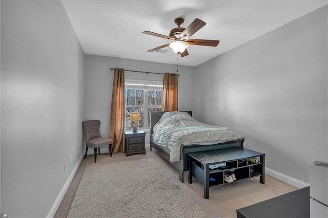 bedroom with baseboards, carpet, and a ceiling fan