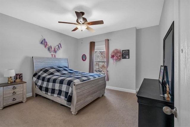 bedroom with light carpet, baseboards, and a ceiling fan
