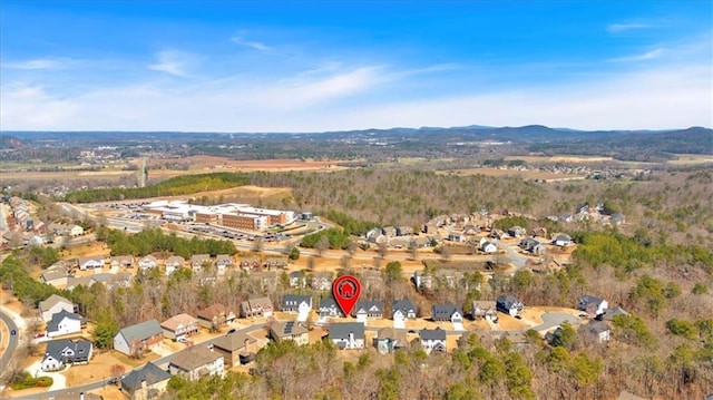 aerial view of property's location featuring nearby suburban area