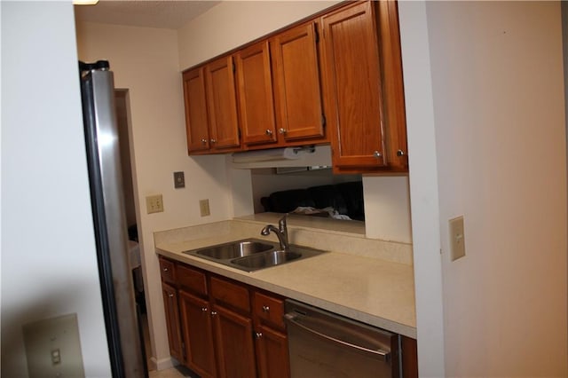 kitchen featuring dishwasher and sink