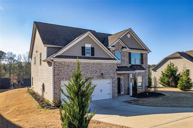 view of front of house featuring driveway, an attached garage, and brick siding