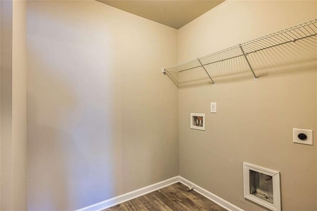 laundry room featuring dark wood finished floors, hookup for a washing machine, laundry area, electric dryer hookup, and baseboards