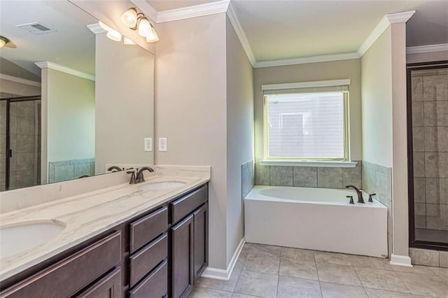 bathroom featuring visible vents, ornamental molding, a shower stall, and a sink