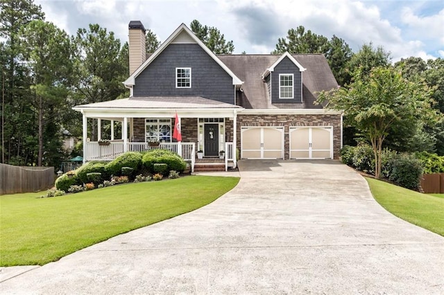 view of front of home with a porch, concrete driveway, a front lawn, and fence