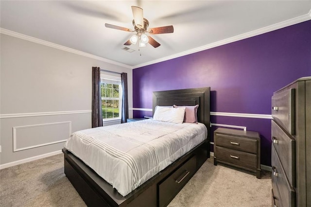 bedroom with ceiling fan, light colored carpet, and ornamental molding