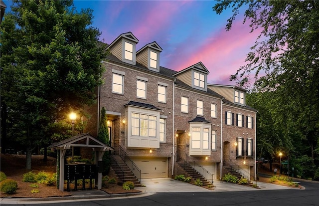 538 Sarabrook Pl, Sandy Springs, GA 30342 - multi unit property featuring stairway, brick siding, a garage, and driveway