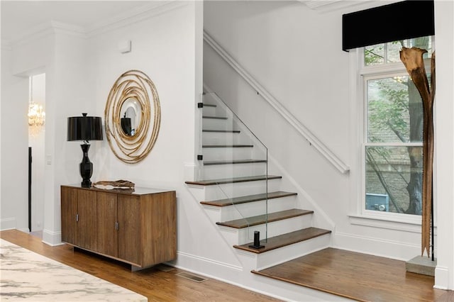 538 Sarabrook Pl, Sandy Springs, GA 30342 - stairs featuring wood finished floors, a chandelier, and crown molding