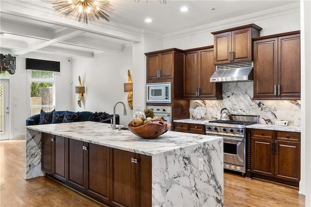538 Sarabrook Pl, Sandy Springs, GA 30342 - kitchen featuring appliances with stainless steel finishes, under cabinet range hood, light wood-style floors, light stone countertops, and beam ceiling