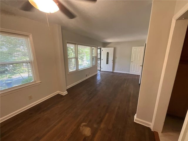 foyer entrance with dark hardwood / wood-style flooring and ceiling fan