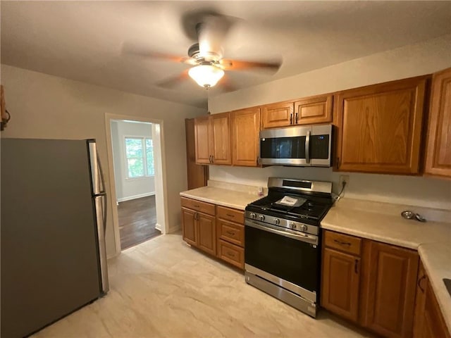 kitchen with stainless steel appliances and ceiling fan