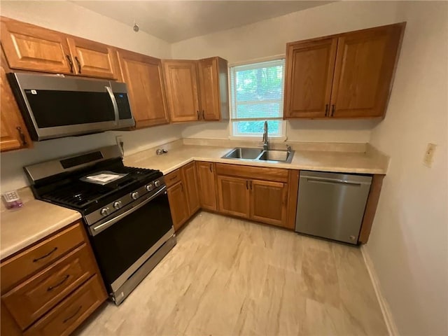 kitchen with appliances with stainless steel finishes and sink