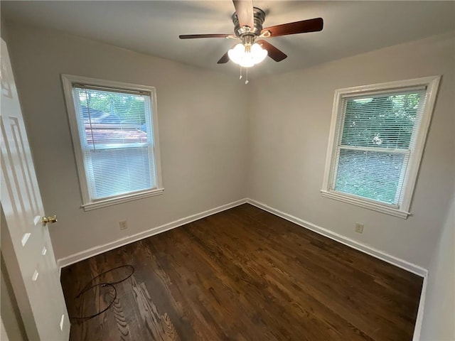 unfurnished room featuring dark hardwood / wood-style floors and ceiling fan