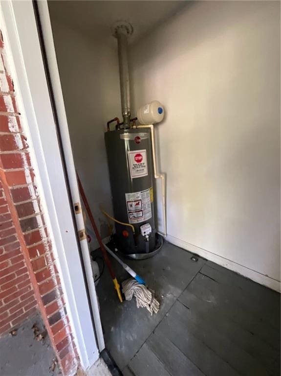 utility room featuring water heater