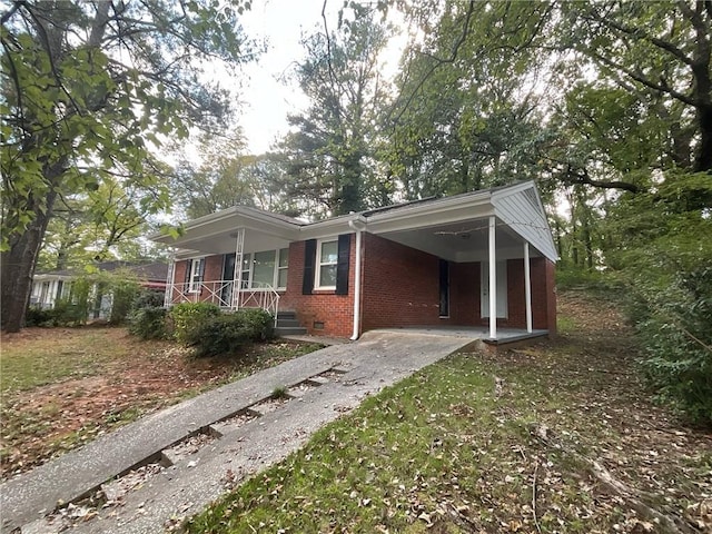 view of side of home featuring covered porch