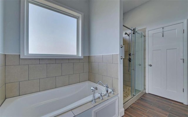 bathroom featuring plus walk in shower