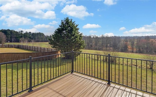 wooden terrace with a yard