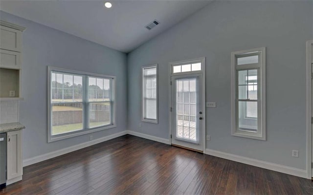 interior space with lofted ceiling and dark hardwood / wood-style flooring