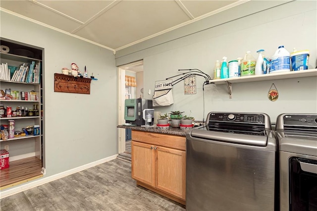 255 Shipp Cir, Hiram, GA 30141 - kitchen featuring independent washer and dryer, crown molding, light wood finished floors, dark countertops, and baseboards