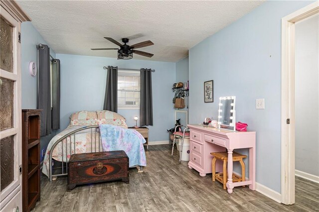 255 Shipp Cir, Hiram, GA 30141 - bedroom with wood finished floors, a textured ceiling, baseboards, and ceiling fan
