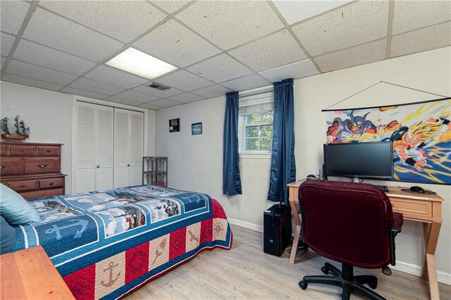 255 Shipp Cir, Hiram, GA 30141 - bedroom featuring wood finished floors, baseboards, a paneled ceiling, an office area, and a closet