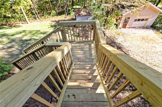 255 Shipp Cir, Hiram, GA 30141 - wooden terrace featuring a detached garage and a lawn