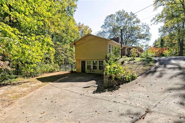255 Shipp Cir, Hiram, GA 30141 - view of property exterior featuring driveway and a chimney