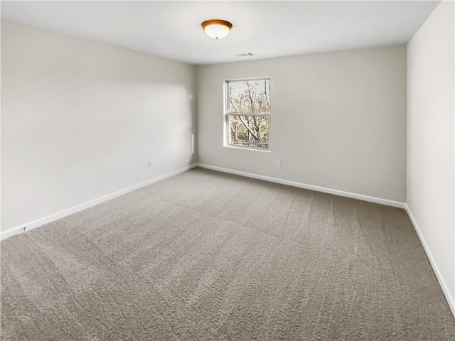 spare room with carpet