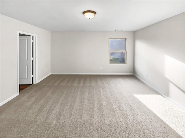 empty room with carpet flooring