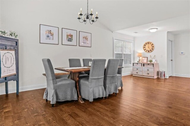 1081 Oak Hill Ln, Madison, GA 30650 - dining space featuring a chandelier, wood finished floors, baseboards, and vaulted ceiling