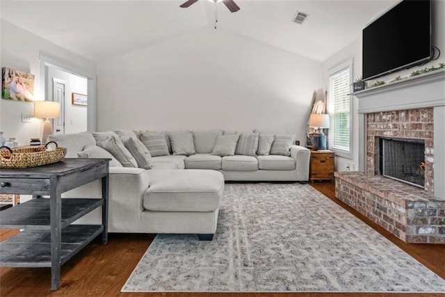 1081 Oak Hill Ln, Madison, GA 30650 - living area with a ceiling fan, dark wood finished floors, vaulted ceiling, and a fireplace