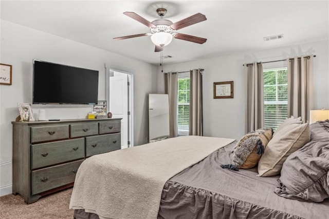 1081 Oak Hill Ln, Madison, GA 30650 - bedroom with light carpet and ceiling fan