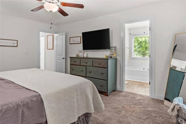 1081 Oak Hill Ln, Madison, GA 30650 - bedroom featuring light carpet, connected bathroom, a ceiling fan, and baseboards