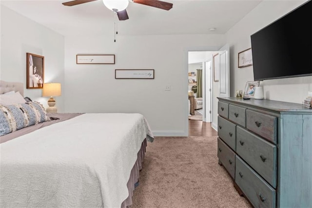 1081 Oak Hill Ln, Madison, GA 30650 - bedroom featuring light carpet, ceiling fan, and baseboards
