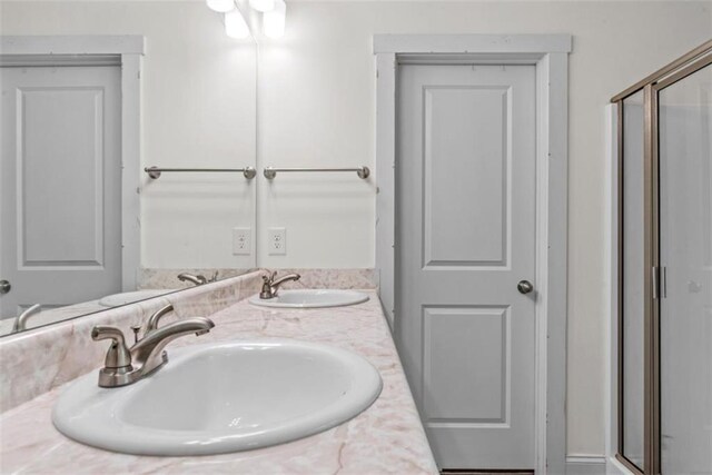 1081 Oak Hill Ln, Madison, GA 30650 - bathroom featuring double vanity and a shower stall