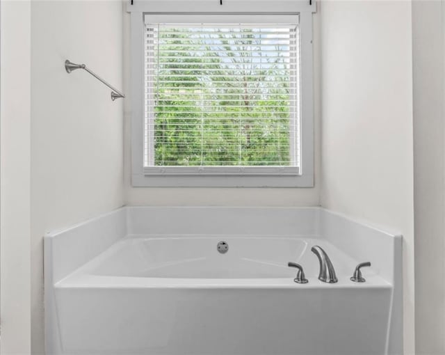 1081 Oak Hill Ln, Madison, GA 30650 - bathroom with healthy amount of natural light and a garden tub