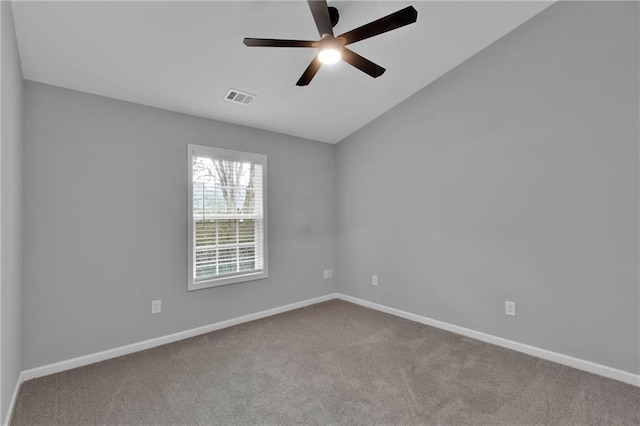 unfurnished room with baseboards, visible vents, a ceiling fan, light colored carpet, and vaulted ceiling