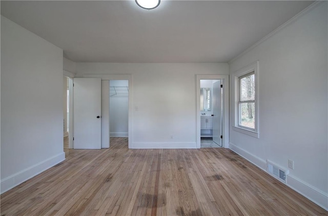 unfurnished room with light hardwood / wood-style flooring