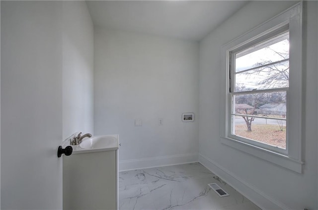 laundry room featuring hookup for a washing machine and sink