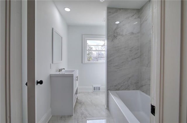 bathroom featuring vanity and shower / tub combination