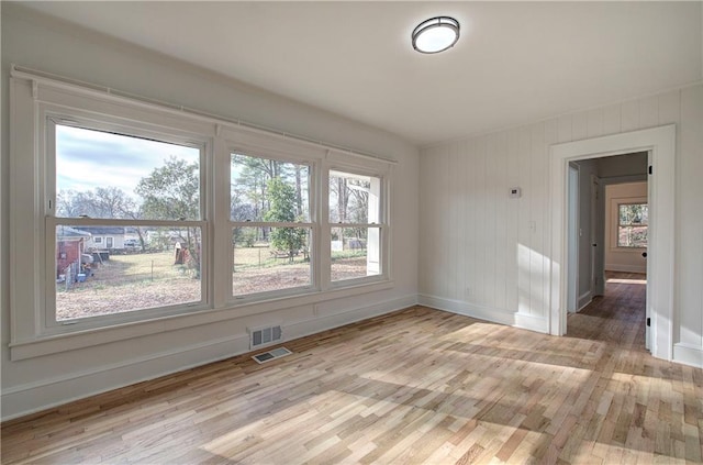 spare room with light wood-type flooring