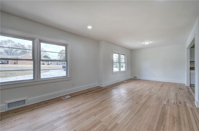 spare room featuring light wood-type flooring