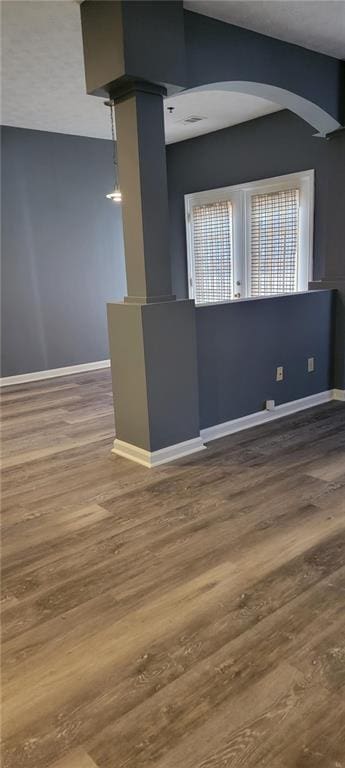 spare room with hardwood / wood-style floors