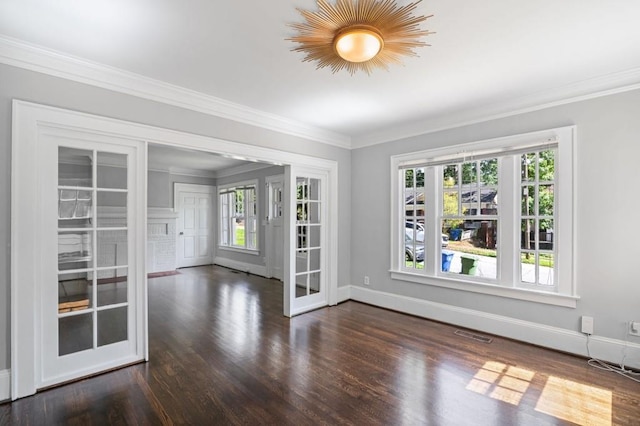 1585 Olympian Cir SW, Atlanta, GA 30310 - unfurnished room featuring dark wood-style flooring, healthy amount of natural light, ornamental molding, and french doors