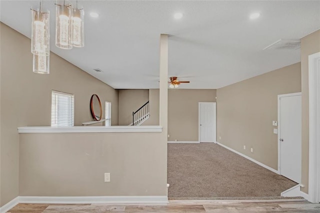 unfurnished room with baseboards, visible vents, a ceiling fan, stairs, and recessed lighting