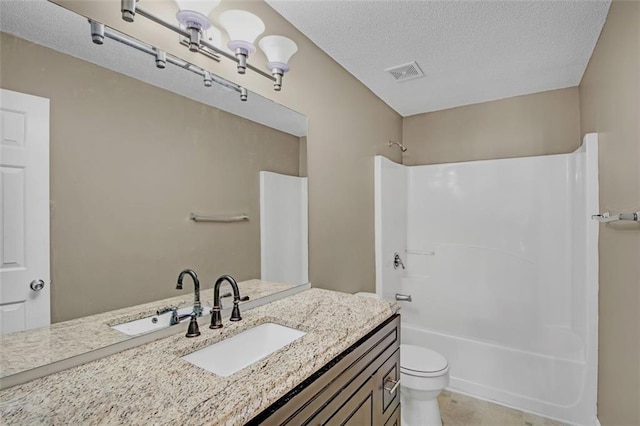 full bathroom featuring visible vents, toilet,  shower combination, a textured ceiling, and vanity