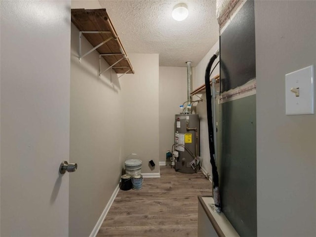 utility room featuring water heater