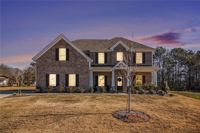 view of front of home with a yard